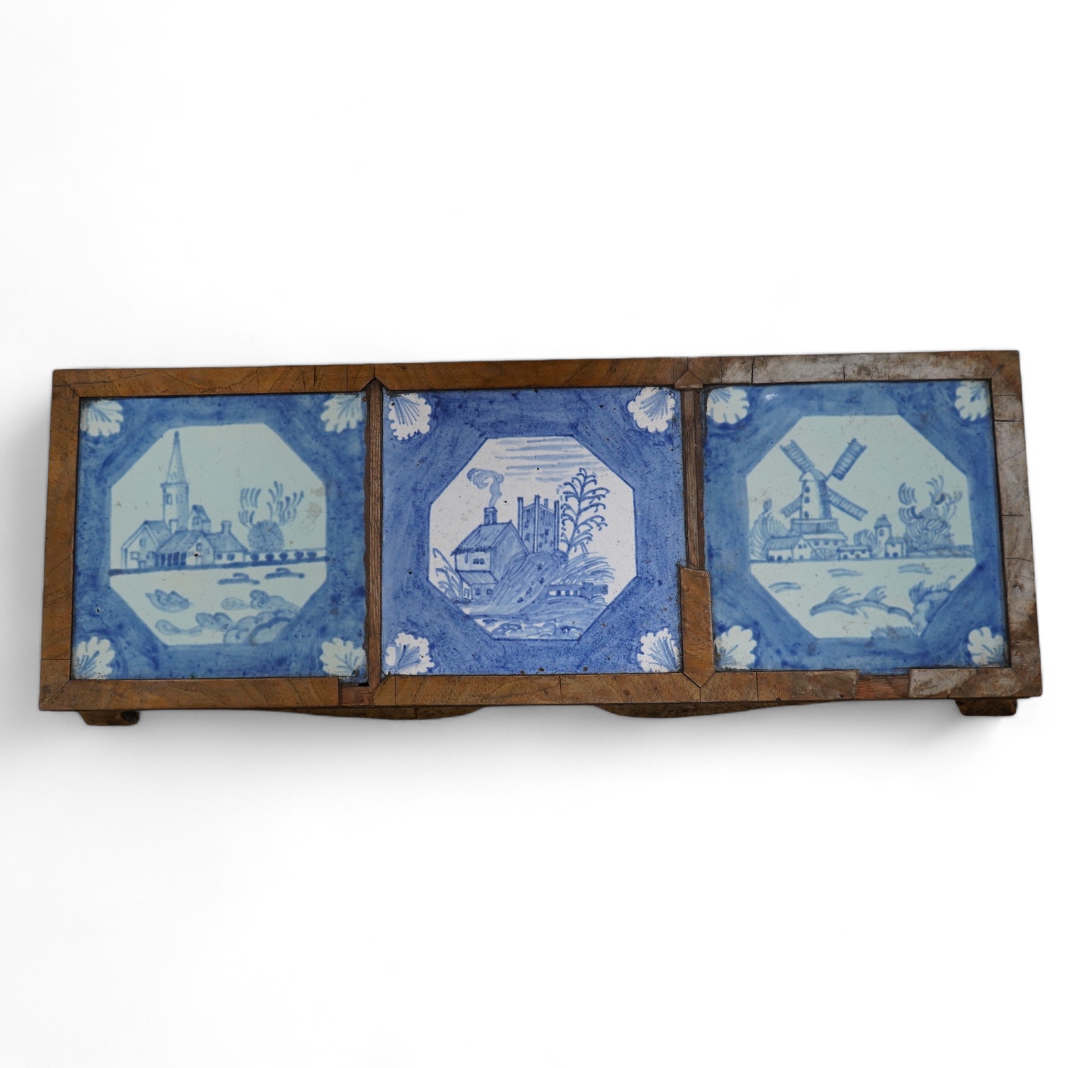 A 19th century Delft tile inset walnut stand, 49cm wide. Condition - poor